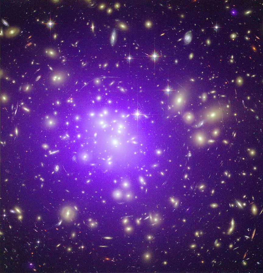 This image of Abell 1689 is a composite of data from the Chandra X-ray Observatory (purple) and the Hubble Space Telescope (yellow). Abell 1689 is a massive cluster of galaxies that shows signs of merging activity. The long arcs in the optical image, the largest system of such arcs ever found, are caused by gravitational lensing of the background galaxies by matter in the galaxy cluster. Further studies of this cluster are needed to explain the lack of agreement between mass estimates based on the X-ray data and on the gravitational lensing.
